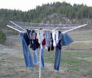 Clothes Hanging On Clothesline. Laundry Hang On Rope To Dry On